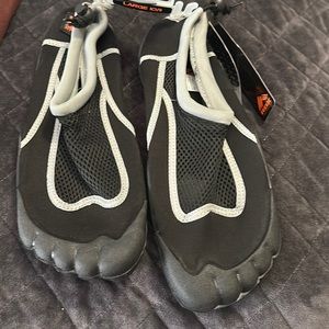 New with tags RBX large, swim shoes for men. Black with gray trim, slip on.